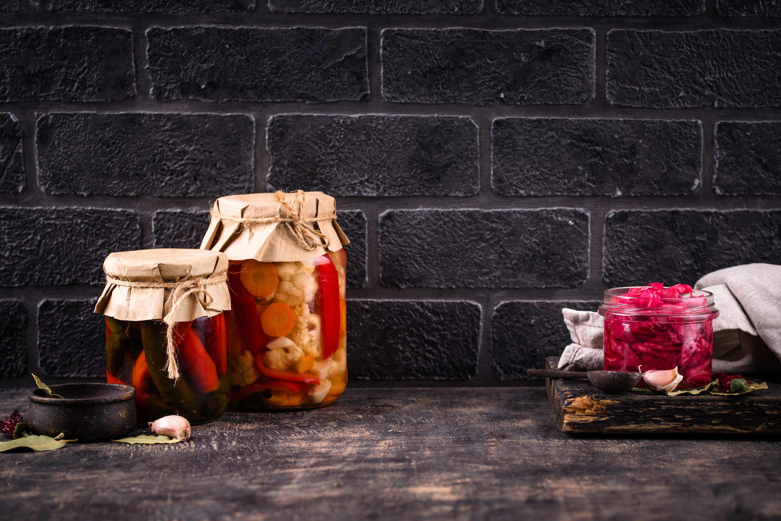 Pickled vegetables in jars on a table